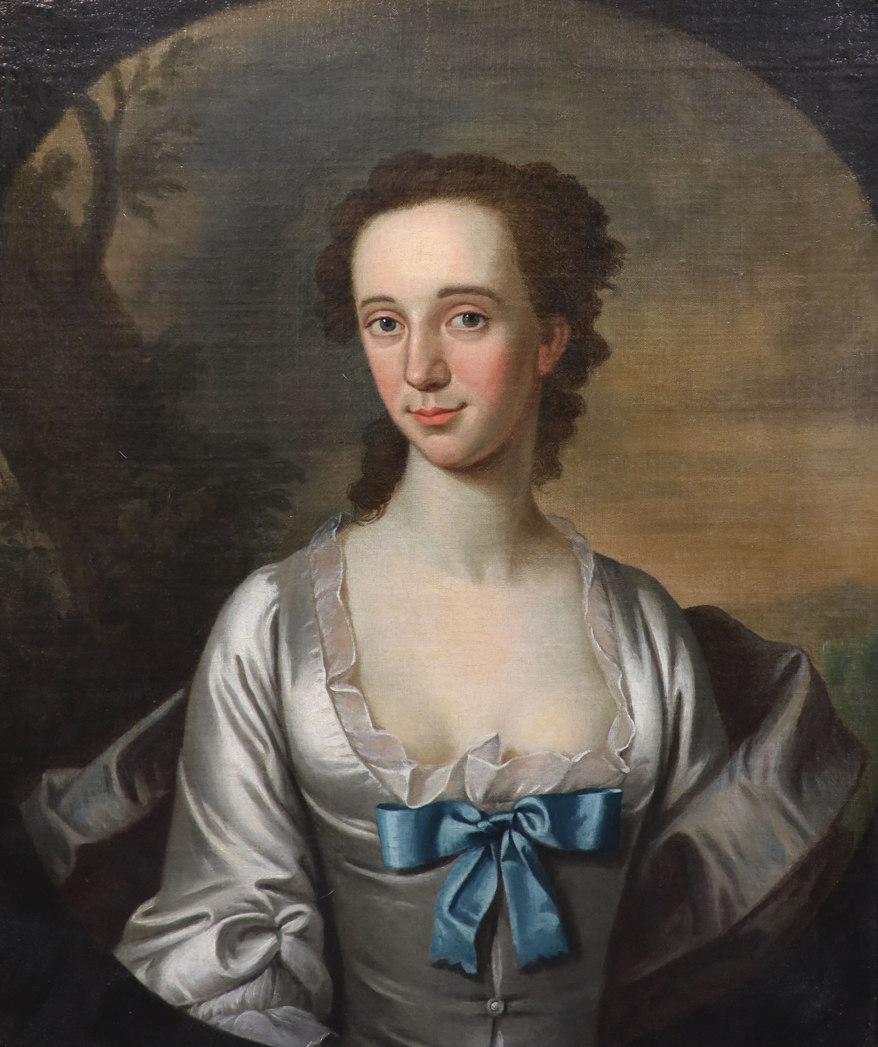 Early 18th century English School, Half length portrait of a lady within a landscape, oil on canvas, 74 x 62cm